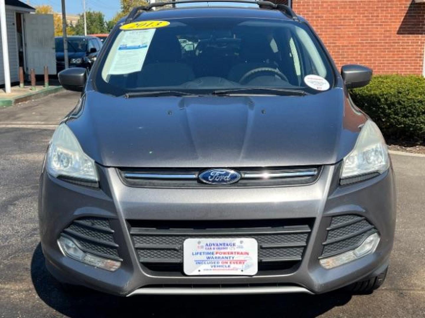 2013 Sterling Grey Metallic Ford Escape SE 4WD (1FMCU9G92DU) with an 2.0L L4 DOHC 16V engine, 6-Speed Automatic transmission, located at 880 E. National Road, Vandalia, OH, 45377, (937) 908-9800, 39.892189, -84.181015 - Photo#1