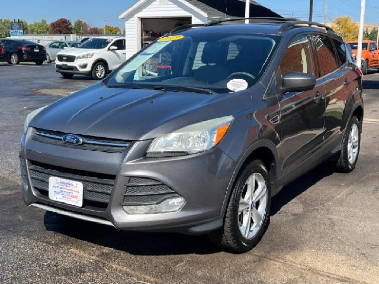 2013 Sterling Grey Metallic Ford Escape SE 4WD (1FMCU9G92DU) with an 2.0L L4 DOHC 16V engine, 6-Speed Automatic transmission, located at 880 E. National Road, Vandalia, OH, 45377, (937) 908-9800, 39.892189, -84.181015 - Photo#2