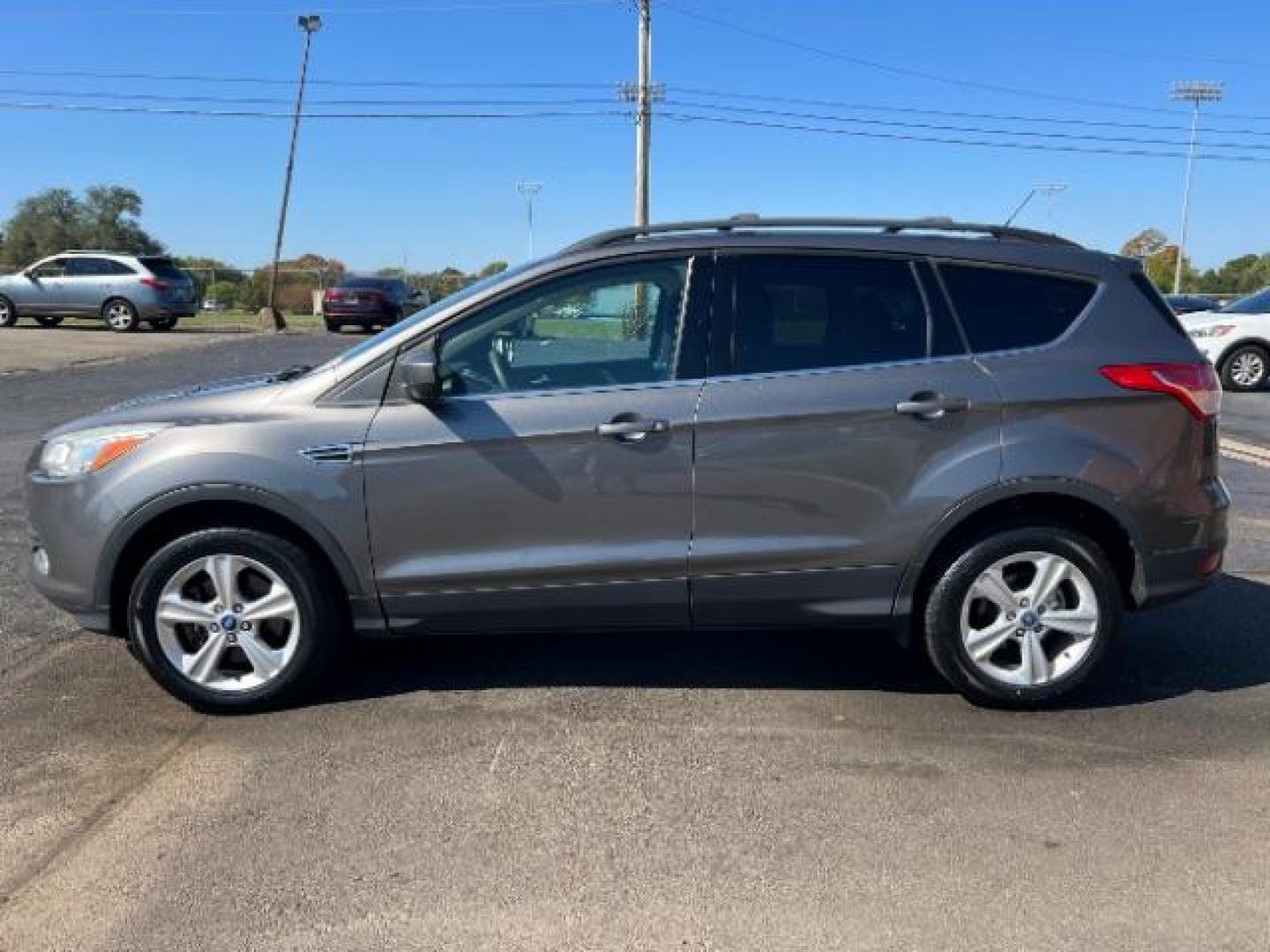 2013 Sterling Grey Metallic Ford Escape SE 4WD (1FMCU9G92DU) with an 2.0L L4 DOHC 16V engine, 6-Speed Automatic transmission, located at 880 E. National Road, Vandalia, OH, 45377, (937) 908-9800, 39.892189, -84.181015 - Photo#3