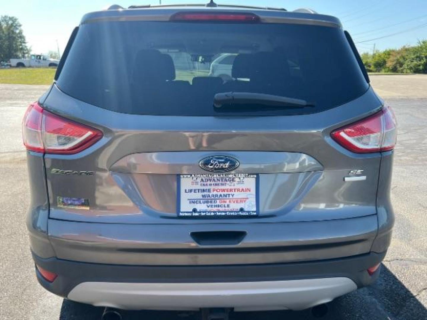 2013 Sterling Grey Metallic Ford Escape SE 4WD (1FMCU9G92DU) with an 2.0L L4 DOHC 16V engine, 6-Speed Automatic transmission, located at 880 E. National Road, Vandalia, OH, 45377, (937) 908-9800, 39.892189, -84.181015 - Photo#4