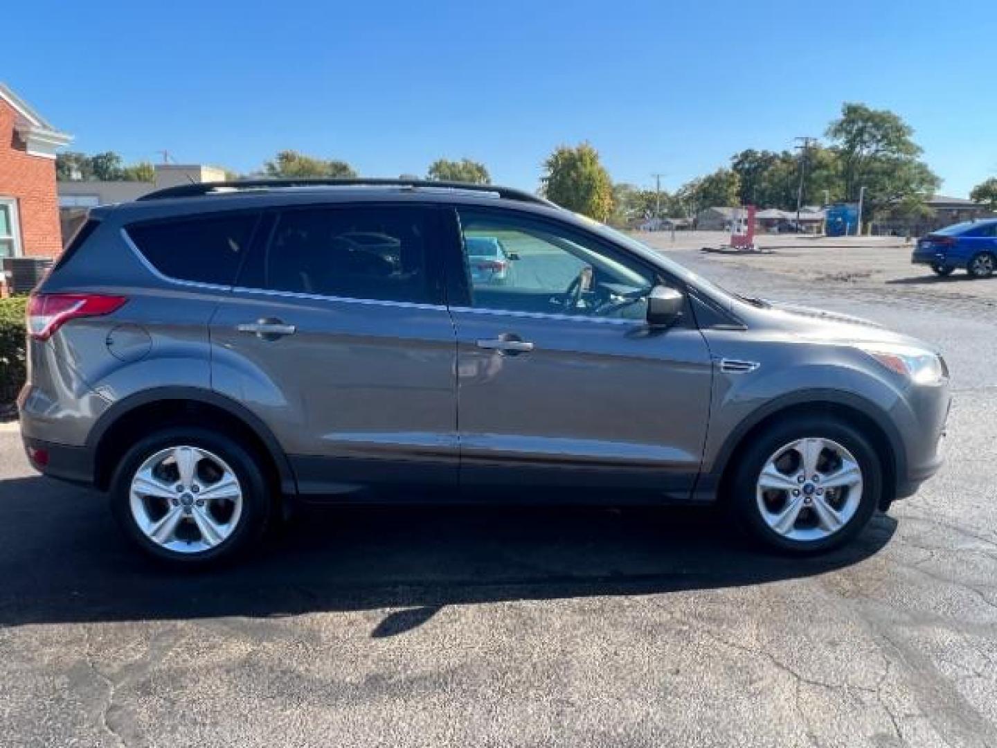 2013 Sterling Grey Metallic Ford Escape SE 4WD (1FMCU9G92DU) with an 2.0L L4 DOHC 16V engine, 6-Speed Automatic transmission, located at 880 E. National Road, Vandalia, OH, 45377, (937) 908-9800, 39.892189, -84.181015 - Photo#5