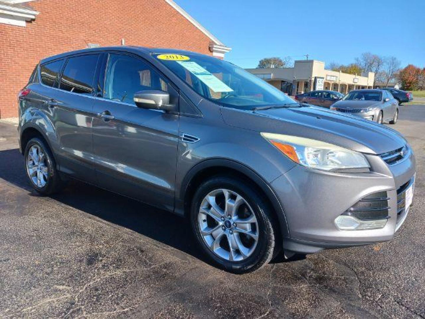 2013 Sterling Grey Metallic Ford Escape SEL 4WD (1FMCU9H94DU) with an 2.0L L4 DOHC 16V engine, 6-Speed Automatic transmission, located at 1099 N County Rd 25A, OH, 45373, (937) 908-9800, 40.057079, -84.212883 - Photo#0