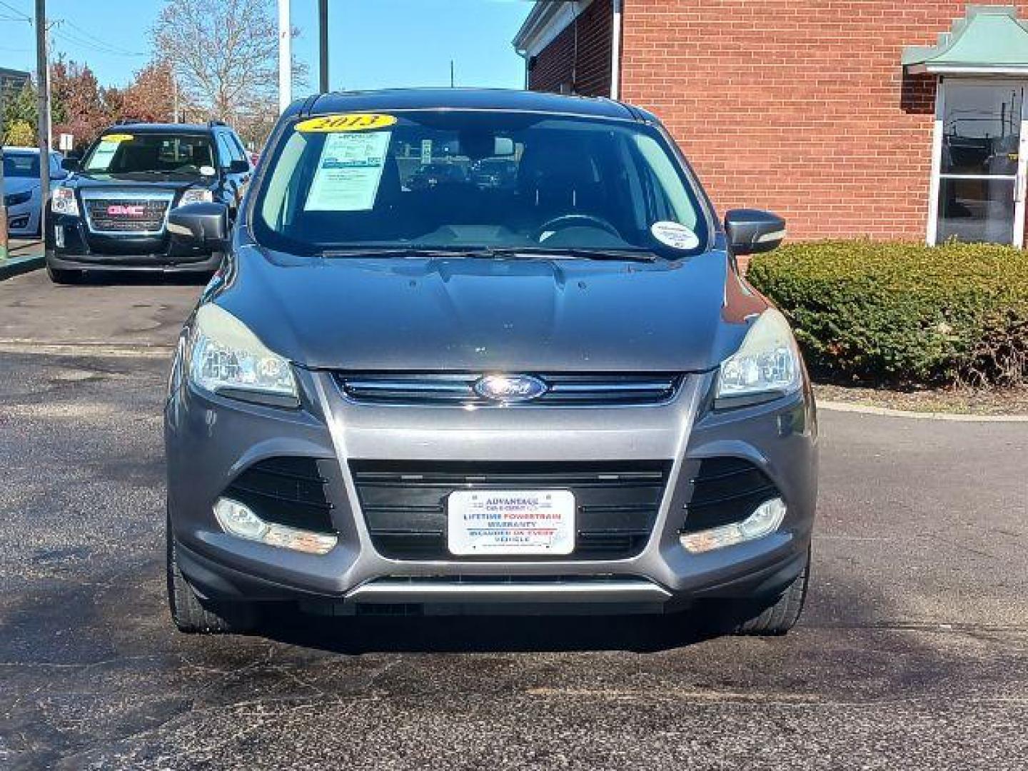 2013 Sterling Grey Metallic Ford Escape SEL 4WD (1FMCU9H94DU) with an 2.0L L4 DOHC 16V engine, 6-Speed Automatic transmission, located at 1099 N County Rd 25A, OH, 45373, (937) 908-9800, 40.057079, -84.212883 - Photo#1