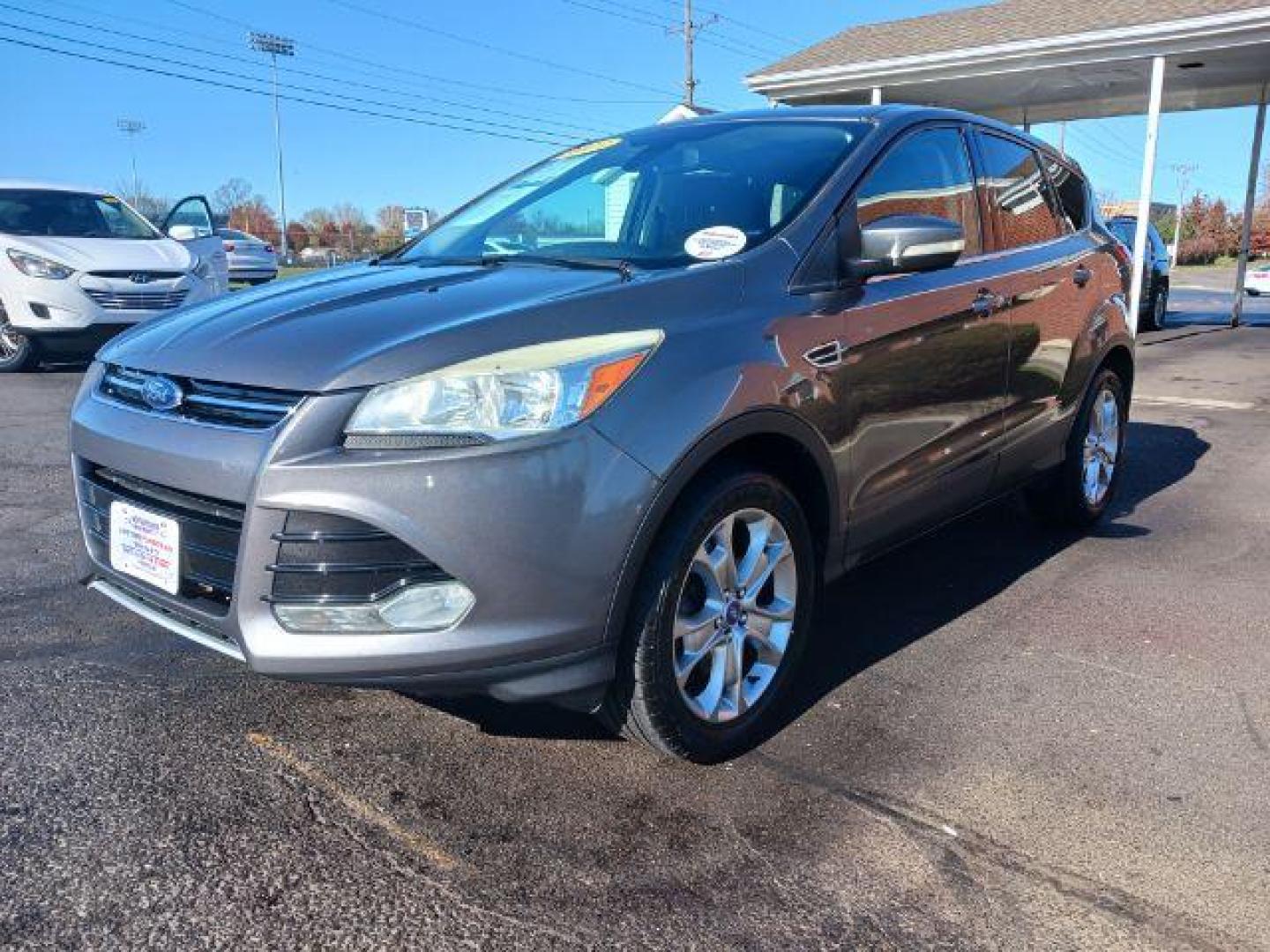 2013 Sterling Grey Metallic Ford Escape SEL 4WD (1FMCU9H94DU) with an 2.0L L4 DOHC 16V engine, 6-Speed Automatic transmission, located at 1099 N County Rd 25A, OH, 45373, (937) 908-9800, 40.057079, -84.212883 - Photo#2