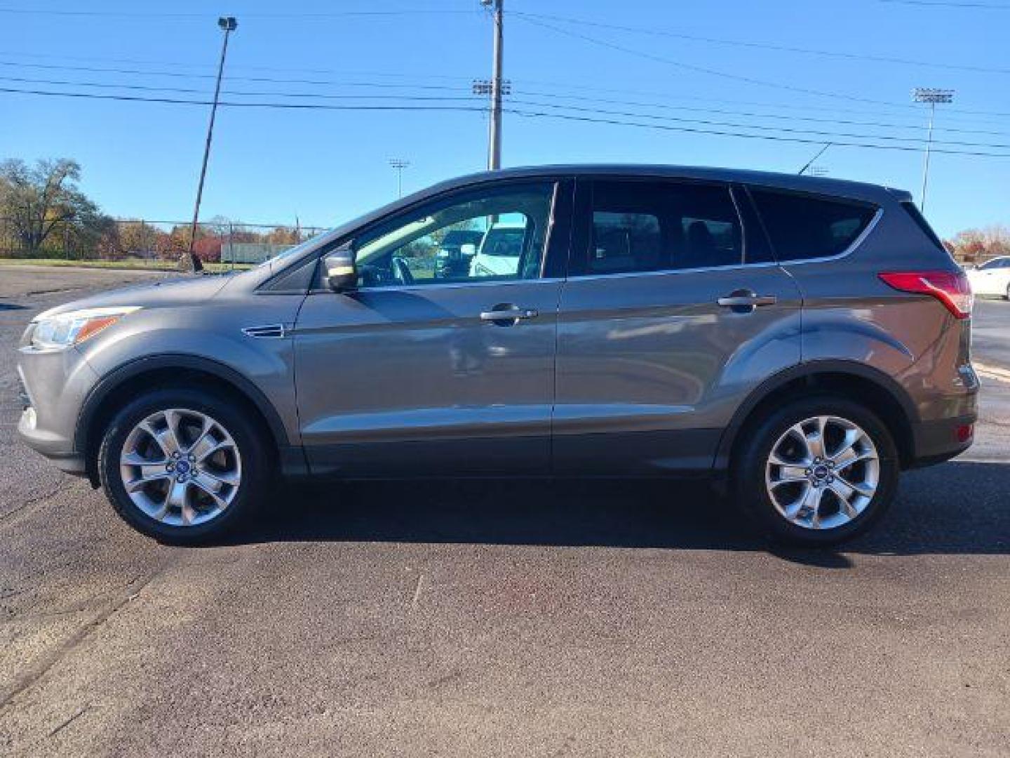 2013 Sterling Grey Metallic Ford Escape SEL 4WD (1FMCU9H94DU) with an 2.0L L4 DOHC 16V engine, 6-Speed Automatic transmission, located at 1099 N County Rd 25A, OH, 45373, (937) 908-9800, 40.057079, -84.212883 - Photo#3