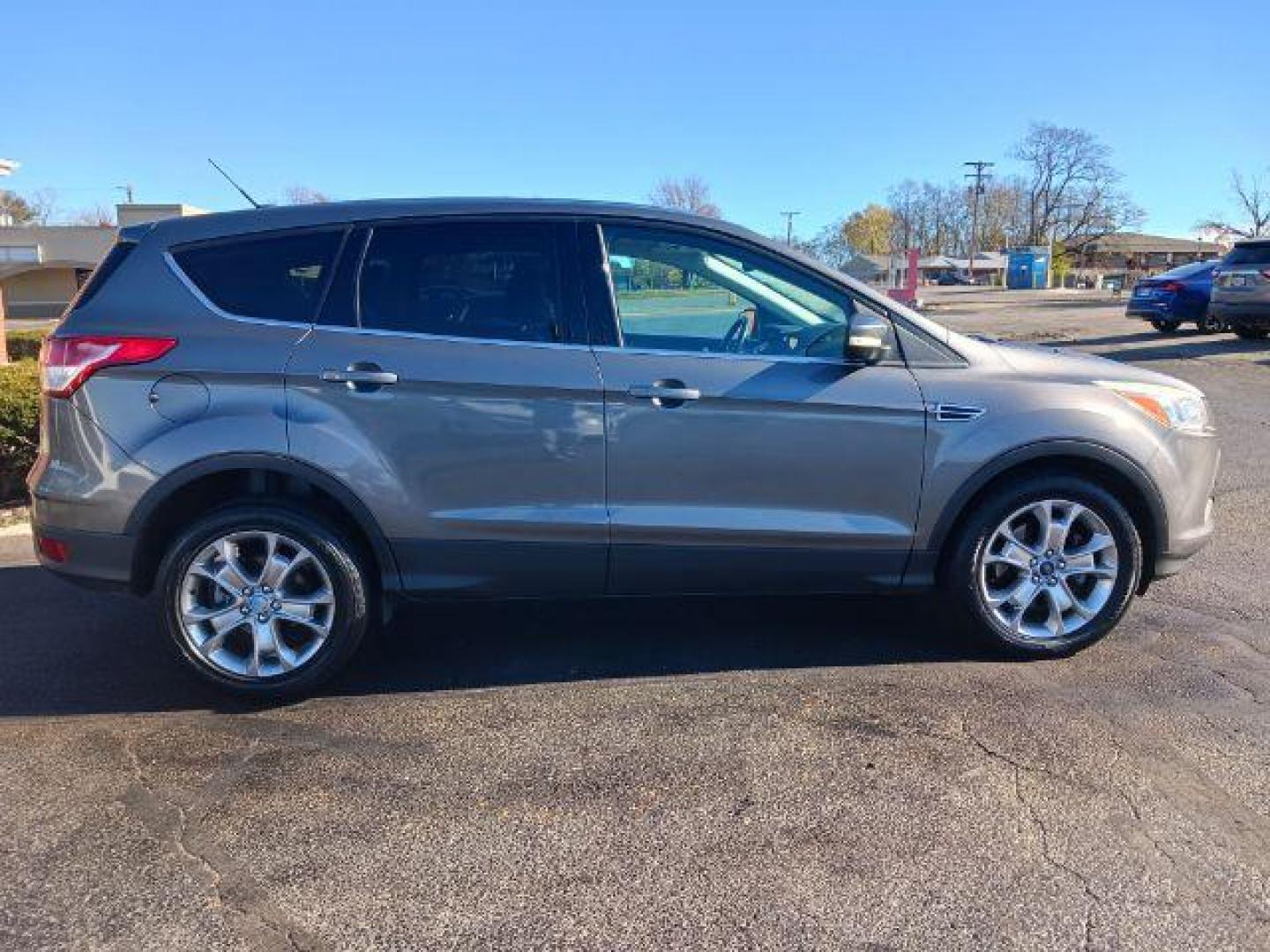 2013 Sterling Grey Metallic Ford Escape SEL 4WD (1FMCU9H94DU) with an 2.0L L4 DOHC 16V engine, 6-Speed Automatic transmission, located at 1099 N County Rd 25A, OH, 45373, (937) 908-9800, 40.057079, -84.212883 - Photo#4