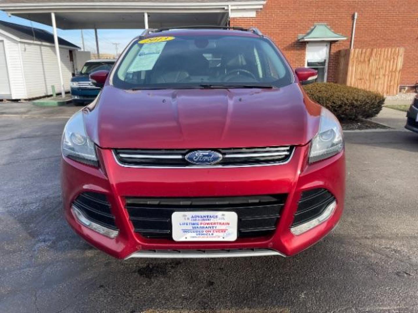 2013 Ruby Red Metallic Tinted Ford Escape Titanium 4WD (1FMCU9J92DU) with an 2.0L L4 DOHC 16V engine, 6-Speed Automatic transmission, located at 4508 South Dixie Dr, Moraine, OH, 45439, (937) 908-9800, 39.690136, -84.216438 - Photo#2