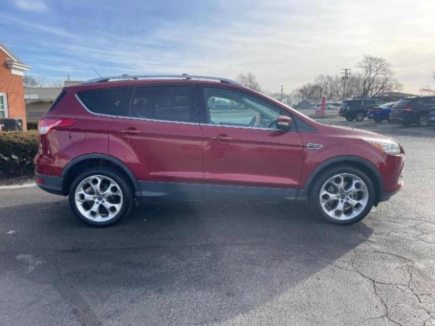 2013 Ruby Red Metallic Tinted Ford Escape Titanium 4WD (1FMCU9J92DU) with an 2.0L L4 DOHC 16V engine, 6-Speed Automatic transmission, located at 4508 South Dixie Dr, Moraine, OH, 45439, (937) 908-9800, 39.690136, -84.216438 - Photo#5