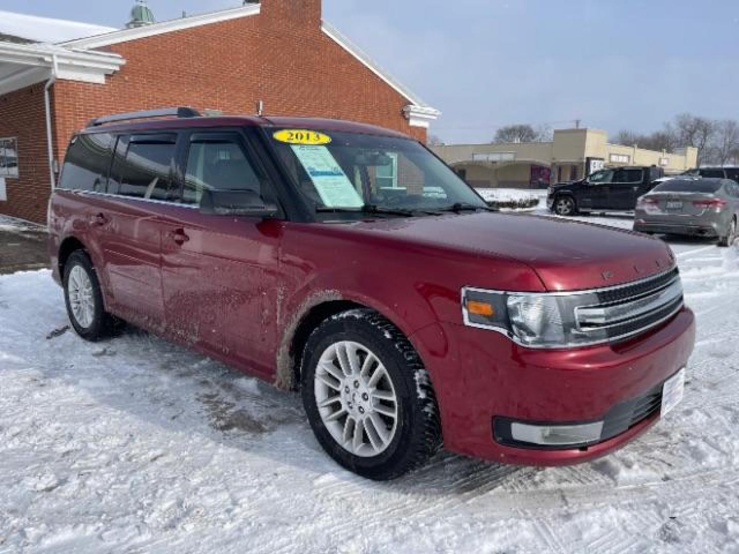 2013 Ruby Red Metallic Tinted Ford Flex SEL FWD (2FMGK5C84DB) with an 3.5L V6 DOHC 24V engine, 6-Speed Automatic Overdrive transmission, located at 1184 Kauffman Ave, Fairborn, OH, 45324, (937) 908-9800, 39.807365, -84.029114 - Photo#0