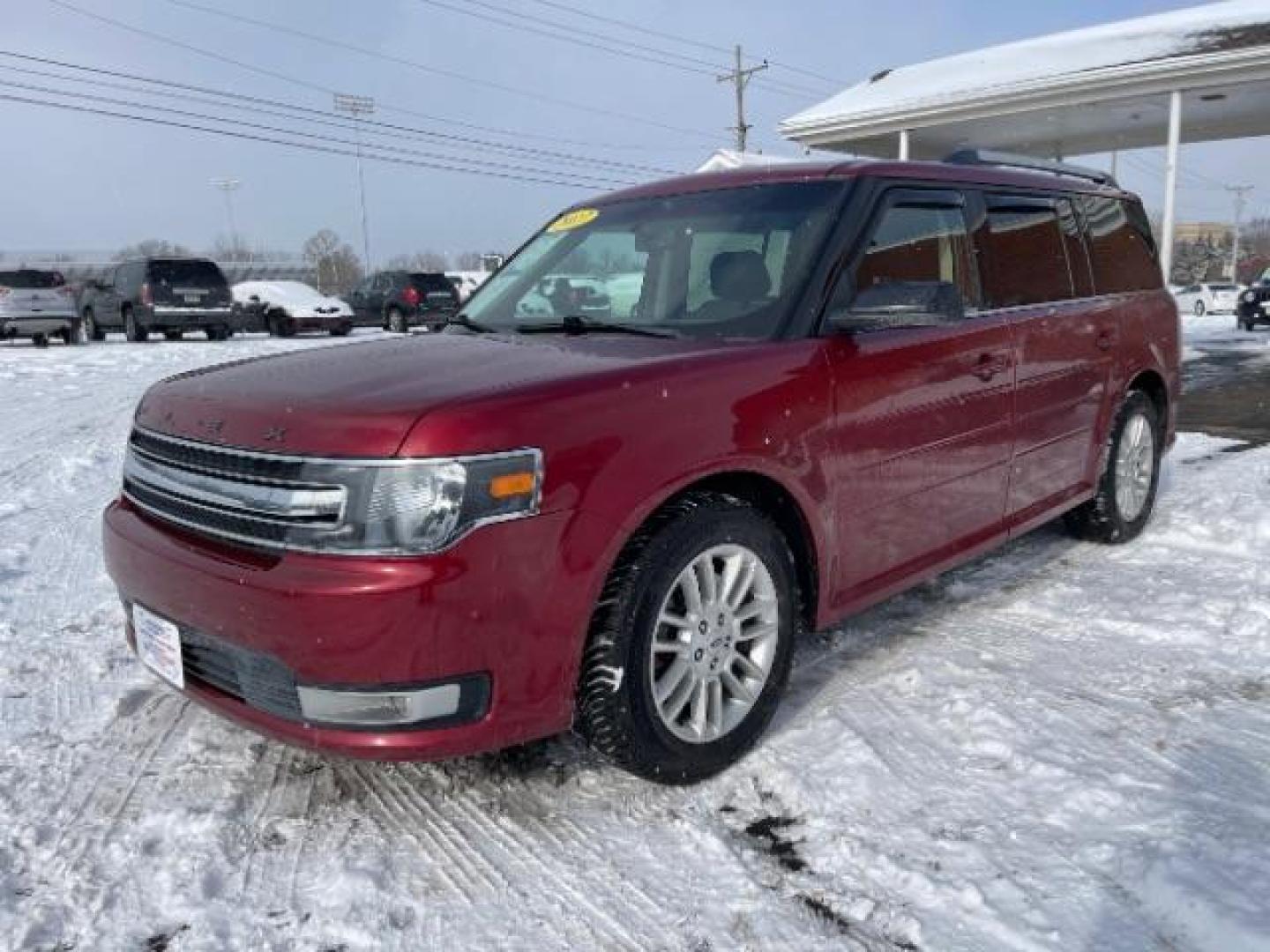 2013 Ruby Red Metallic Tinted Ford Flex SEL FWD (2FMGK5C84DB) with an 3.5L V6 DOHC 24V engine, 6-Speed Automatic Overdrive transmission, located at 1184 Kauffman Ave, Fairborn, OH, 45324, (937) 908-9800, 39.807365, -84.029114 - Photo#1