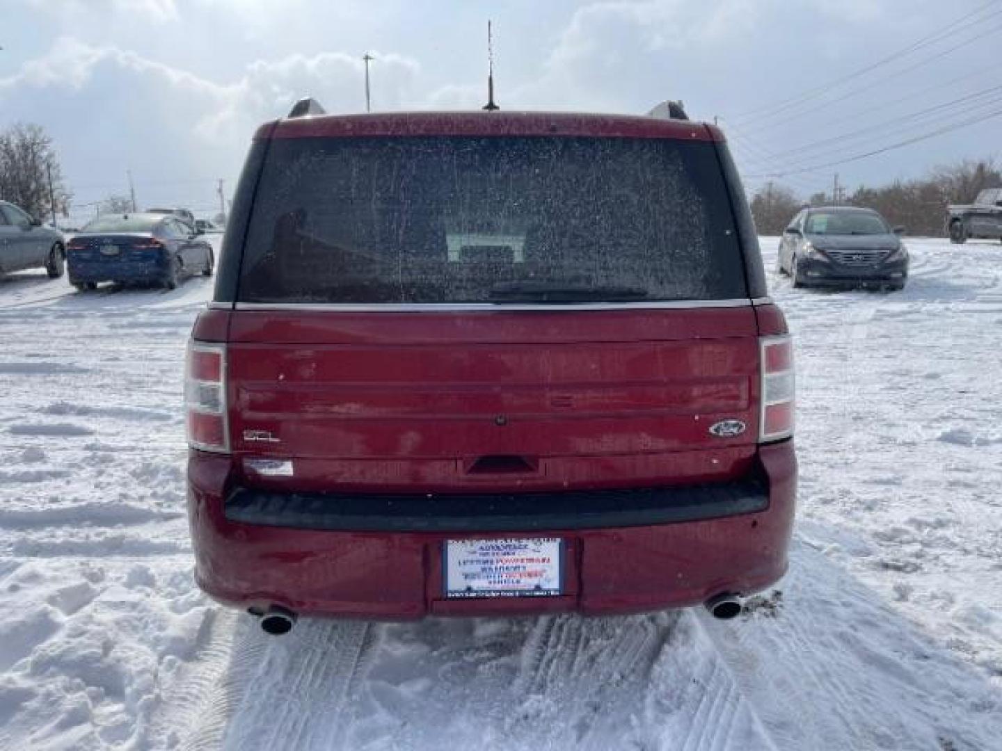 2013 Ruby Red Metallic Tinted Ford Flex SEL FWD (2FMGK5C84DB) with an 3.5L V6 DOHC 24V engine, 6-Speed Automatic Overdrive transmission, located at 1184 Kauffman Ave, Fairborn, OH, 45324, (937) 908-9800, 39.807365, -84.029114 - Photo#3