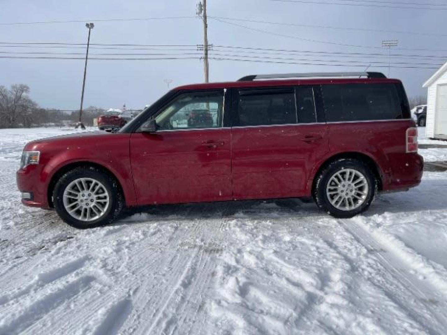 2013 Ruby Red Metallic Tinted Ford Flex SEL FWD (2FMGK5C84DB) with an 3.5L V6 DOHC 24V engine, 6-Speed Automatic Overdrive transmission, located at 1184 Kauffman Ave, Fairborn, OH, 45324, (937) 908-9800, 39.807365, -84.029114 - Photo#4