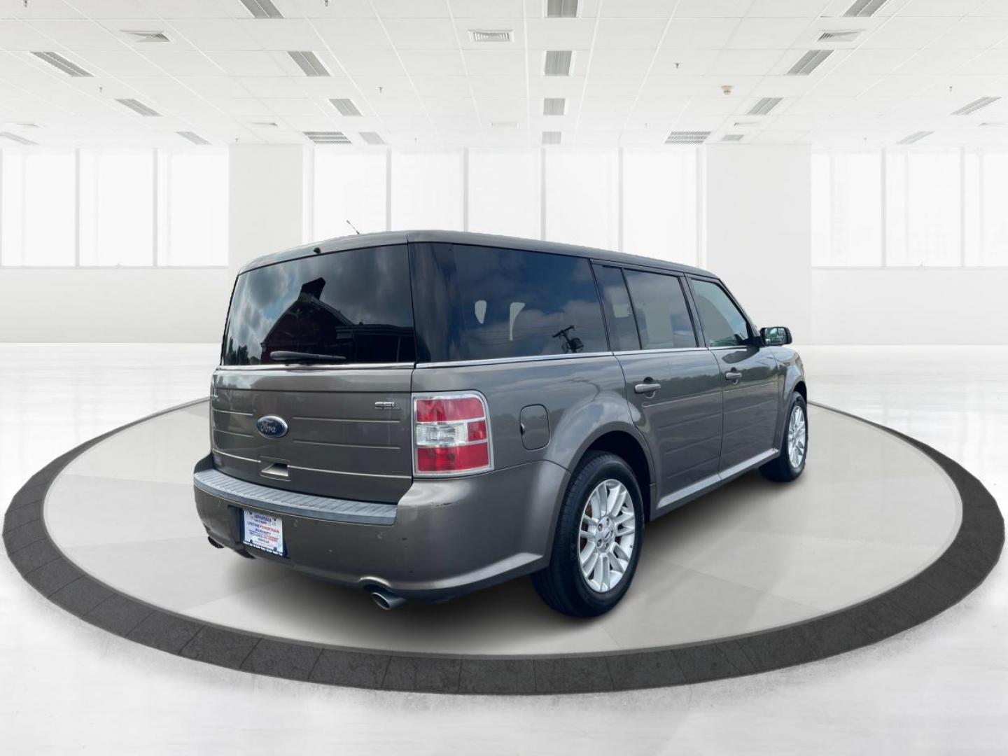 2013 Mineral Gray Metallic Ford Flex SEL FWD (2FMGK5C85DB) with an 3.5L V6 DOHC 24V engine, 6-Speed Automatic Overdrive transmission, located at 880 E. National Road, Vandalia, OH, 45377, (937) 908-9800, 39.892189, -84.181015 - Third Row - Photo#2