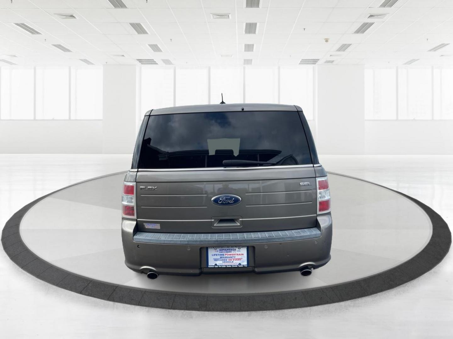 2013 Mineral Gray Metallic Ford Flex SEL FWD (2FMGK5C85DB) with an 3.5L V6 DOHC 24V engine, 6-Speed Automatic Overdrive transmission, located at 880 E. National Road, Vandalia, OH, 45377, (937) 908-9800, 39.892189, -84.181015 - Third Row - Photo#3