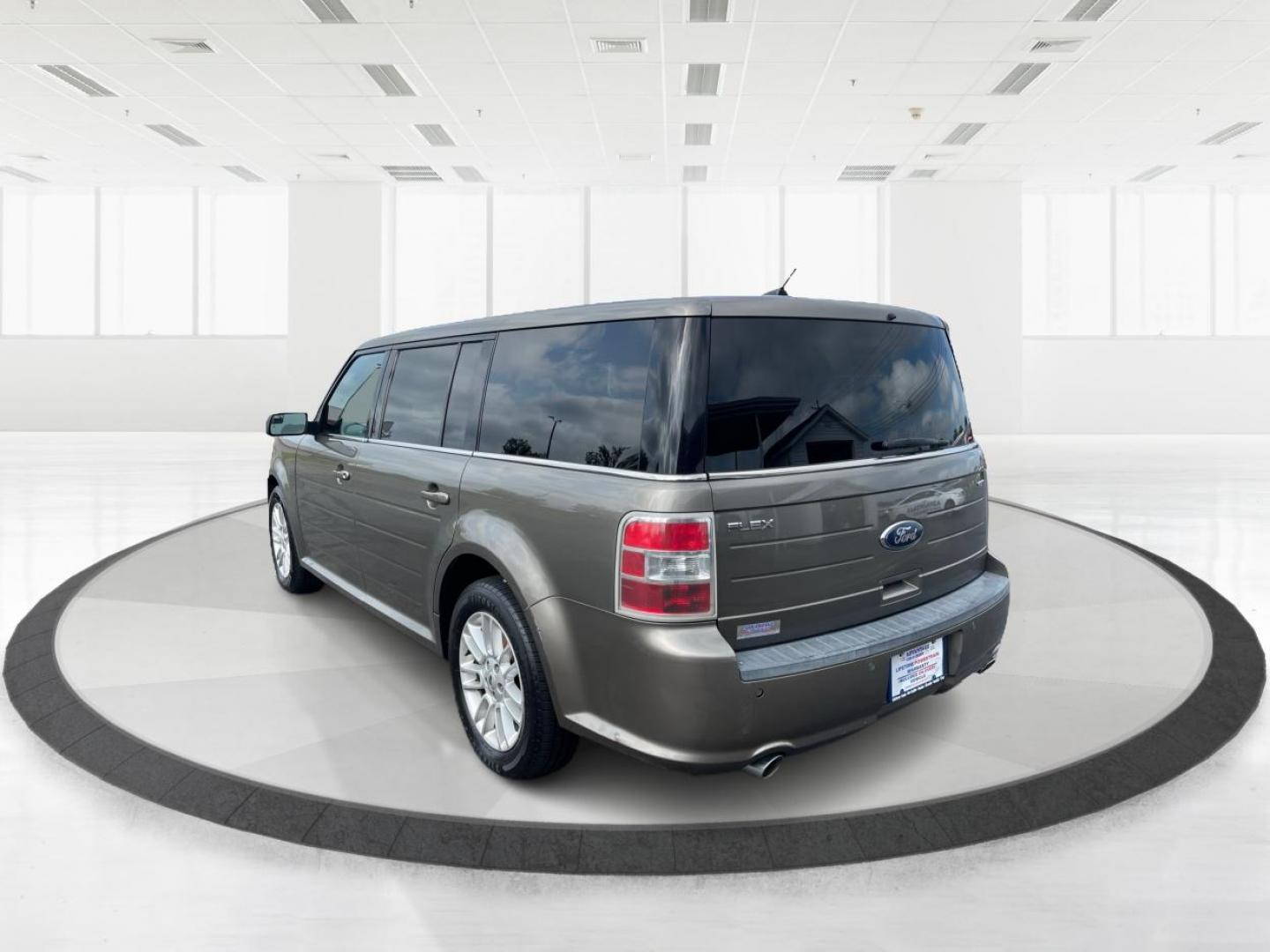 2013 Mineral Gray Metallic Ford Flex SEL FWD (2FMGK5C85DB) with an 3.5L V6 DOHC 24V engine, 6-Speed Automatic Overdrive transmission, located at 880 E. National Road, Vandalia, OH, 45377, (937) 908-9800, 39.892189, -84.181015 - Third Row - Photo#4