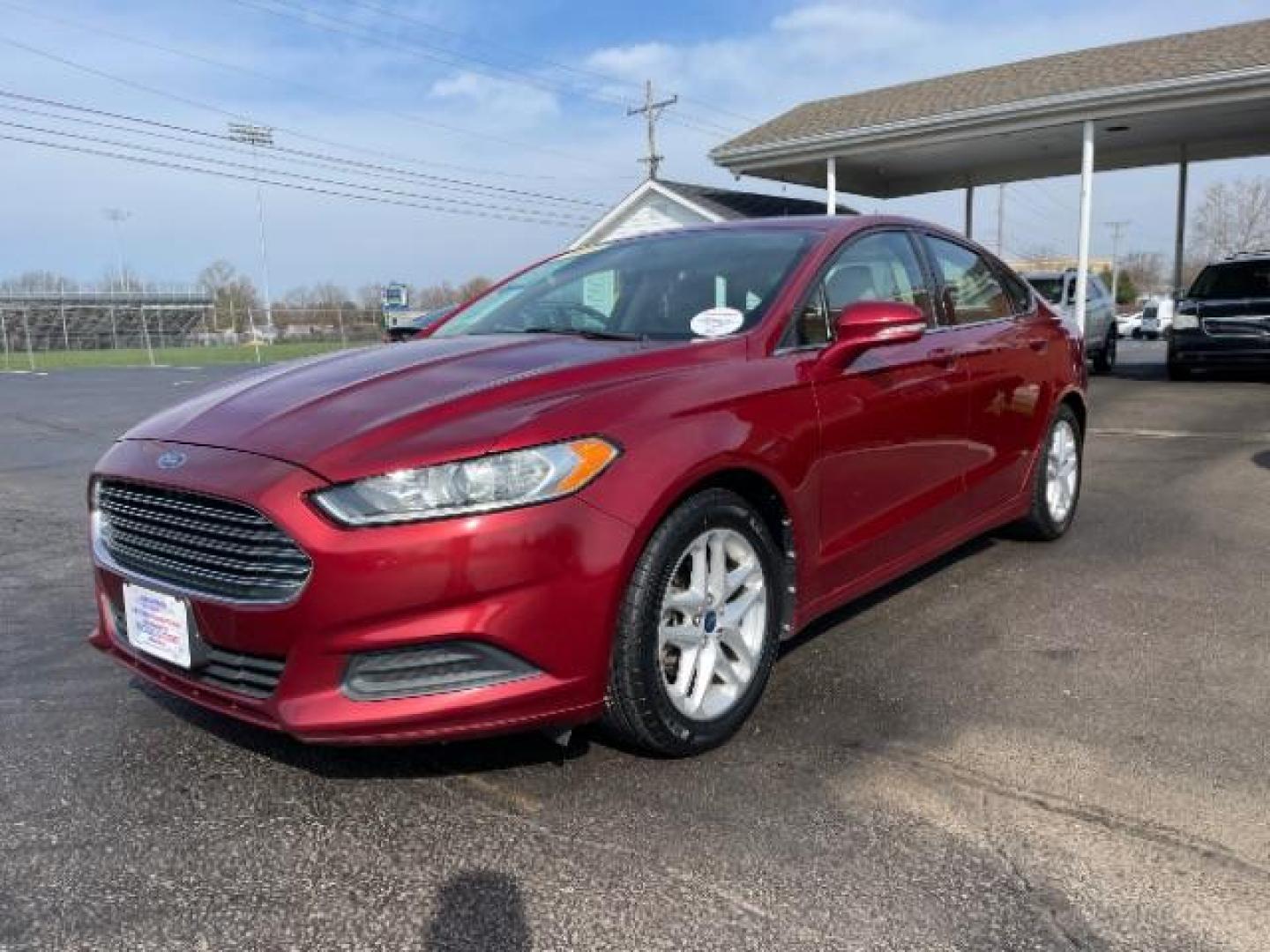 2013 Ruby Red Met Tinted CC Ford Fusion SE (3FA6P0H7XDR) with an 2.5L L4 DOHC 16V engine, located at 1184 Kauffman Ave, Fairborn, OH, 45324, (937) 908-9800, 39.807365, -84.029114 - Photo#1