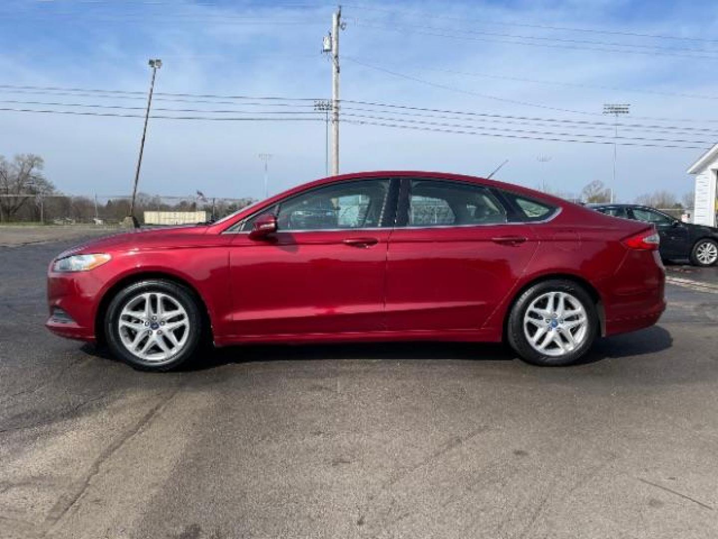 2013 Ruby Red Met Tinted CC Ford Fusion SE (3FA6P0H7XDR) with an 2.5L L4 DOHC 16V engine, located at 1184 Kauffman Ave, Fairborn, OH, 45324, (937) 908-9800, 39.807365, -84.029114 - Photo#2