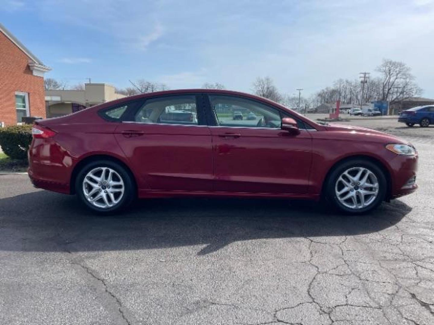 2013 Ruby Red Met Tinted CC Ford Fusion SE (3FA6P0H7XDR) with an 2.5L L4 DOHC 16V engine, located at 1184 Kauffman Ave, Fairborn, OH, 45324, (937) 908-9800, 39.807365, -84.029114 - Photo#3