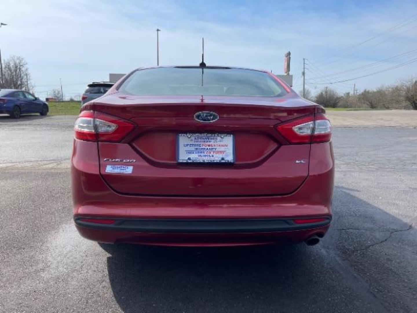 2013 Ruby Red Met Tinted CC Ford Fusion SE (3FA6P0H7XDR) with an 2.5L L4 DOHC 16V engine, located at 1184 Kauffman Ave, Fairborn, OH, 45324, (937) 908-9800, 39.807365, -84.029114 - Photo#4