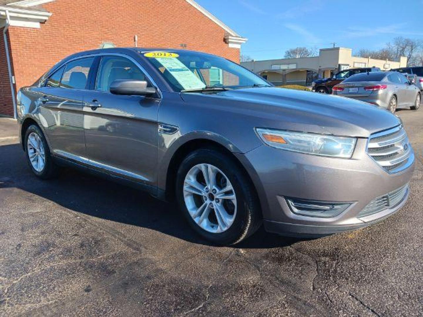 2013 Sterling Gray Metallic Ford Taurus SEL FWD (1FAHP2E81DG) with an 3.5L V6 DOHC 24V engine, 6-Speed Automatic transmission, located at 1099 N County Rd 25A, OH, 45373, (937) 908-9800, 40.057079, -84.212883 - Photo#0