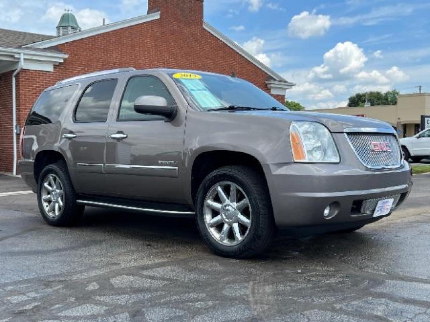 2013 Mocha Steel Metallic GMC Yukon Denali 4WD (1GKS2EEF1DR) with an 6.2L V8 OHV 16V engine, 6-Speed Automatic transmission, located at 880 E. National Road, Vandalia, OH, 45377, (937) 908-9800, 39.892189, -84.181015 - Photo#0