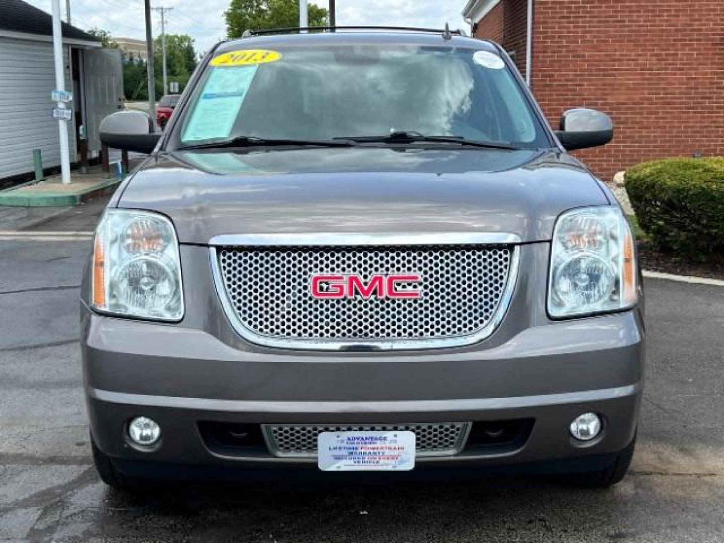 2013 Mocha Steel Metallic GMC Yukon Denali 4WD (1GKS2EEF1DR) with an 6.2L V8 OHV 16V engine, 6-Speed Automatic transmission, located at 880 E. National Road, Vandalia, OH, 45377, (937) 908-9800, 39.892189, -84.181015 - Photo#1