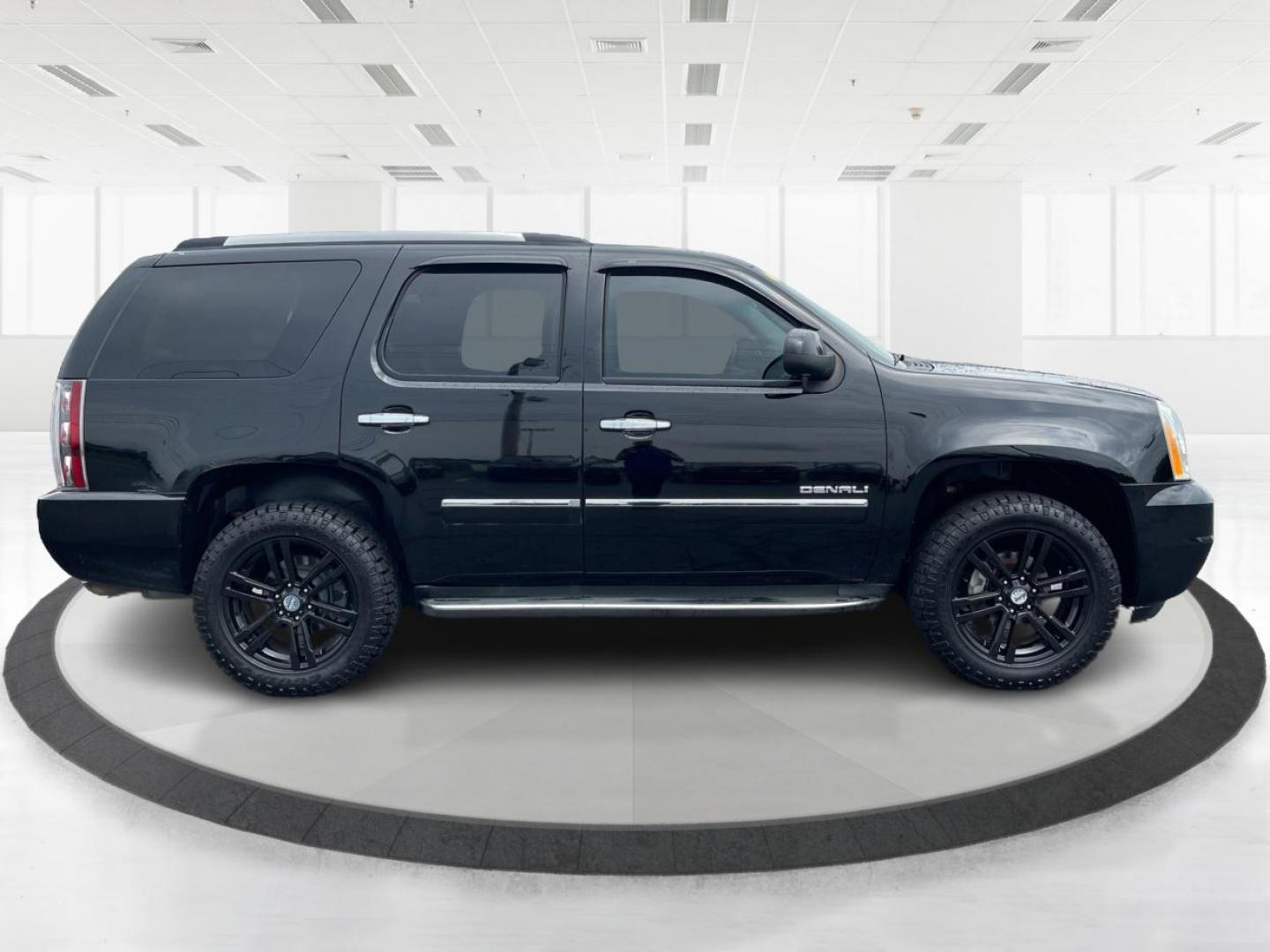 2013 Carbon Black Metallic GMC Yukon Denali 4WD (1GKS2EEF0DR) with an 6.2L V8 OHV 16V engine, 6-Speed Automatic transmission, located at 1099 N County Rd 25A, OH, 45373, (937) 908-9800, 40.057079, -84.212883 - Photo#1