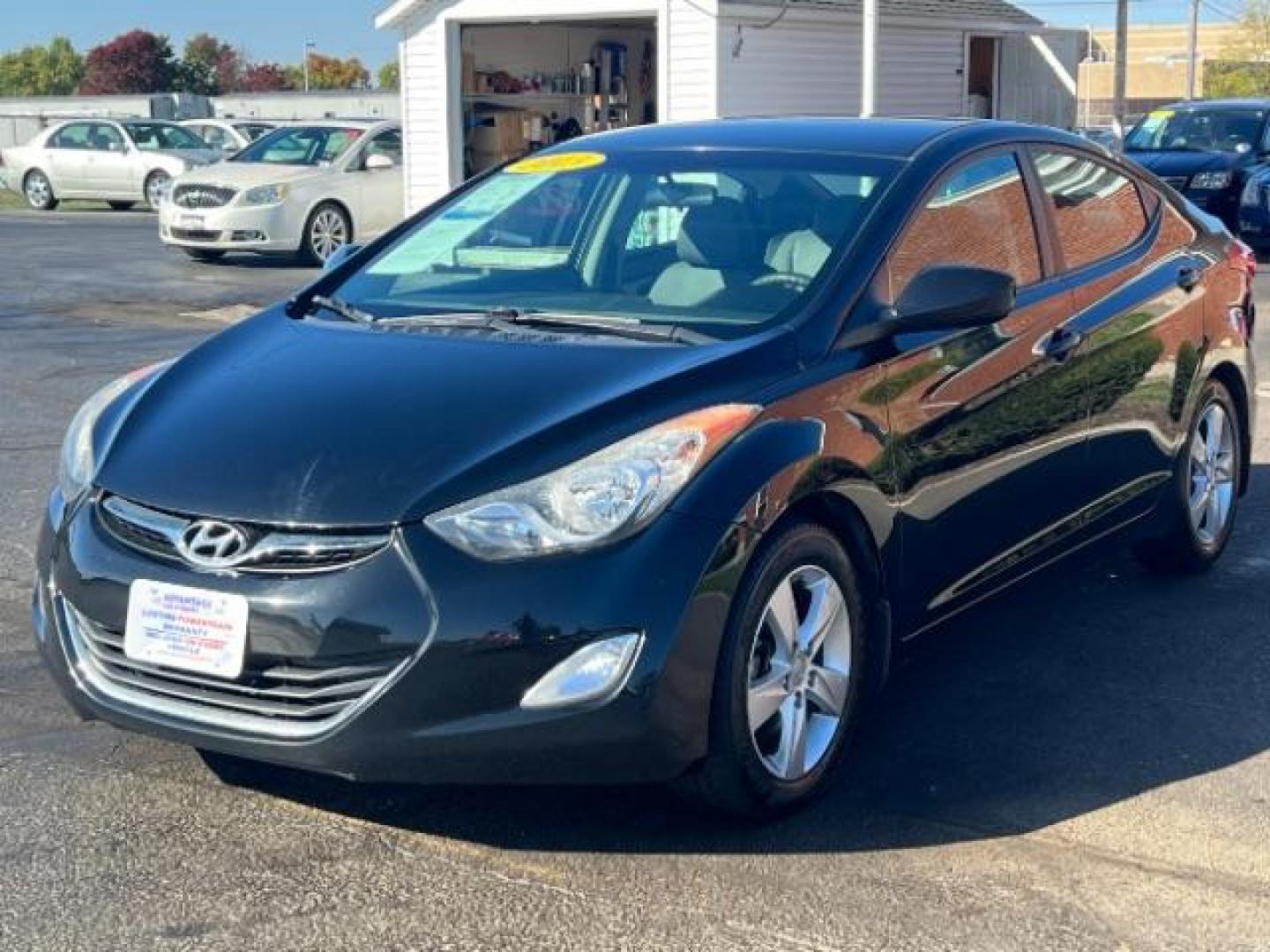 2013 Midnight Black Metallic Hyundai Elantra Limited (5NPDH4AE7DH) with an 1.8L L4 DOHC 16V engine, 6-Speed Automatic transmission, located at 1951 S Dayton Lakeview Rd., New Carlisle, OH, 45344, (937) 908-9800, 39.890999, -84.050255 - Photo#2