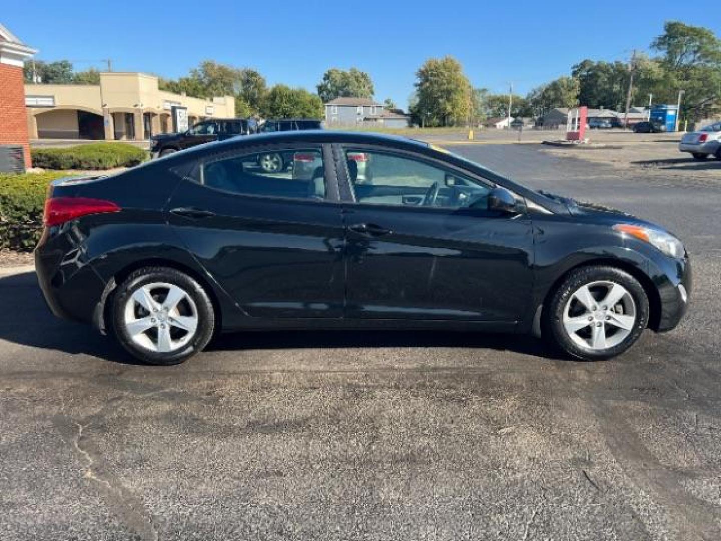 2013 Midnight Black Metallic Hyundai Elantra Limited (5NPDH4AE7DH) with an 1.8L L4 DOHC 16V engine, 6-Speed Automatic transmission, located at 1951 S Dayton Lakeview Rd., New Carlisle, OH, 45344, (937) 908-9800, 39.890999, -84.050255 - Photo#5