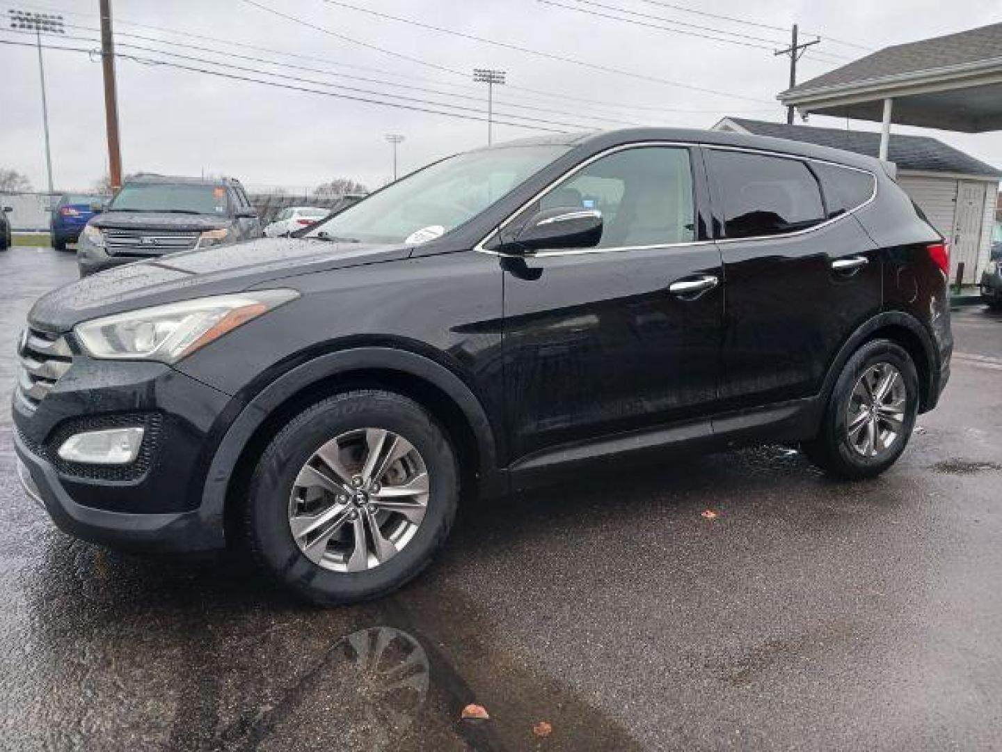 2013 Twilight Black Hyundai Santa Fe Sport 2.4 FWD (5XYZU3LB3DG) with an 2.4L L4 DOHC 16V engine, 6-Speed Automatic transmission, located at 401 Woodman Dr, Riverside, OH, 45431, (937) 908-9800, 39.763779, -84.122063 - Photo#2