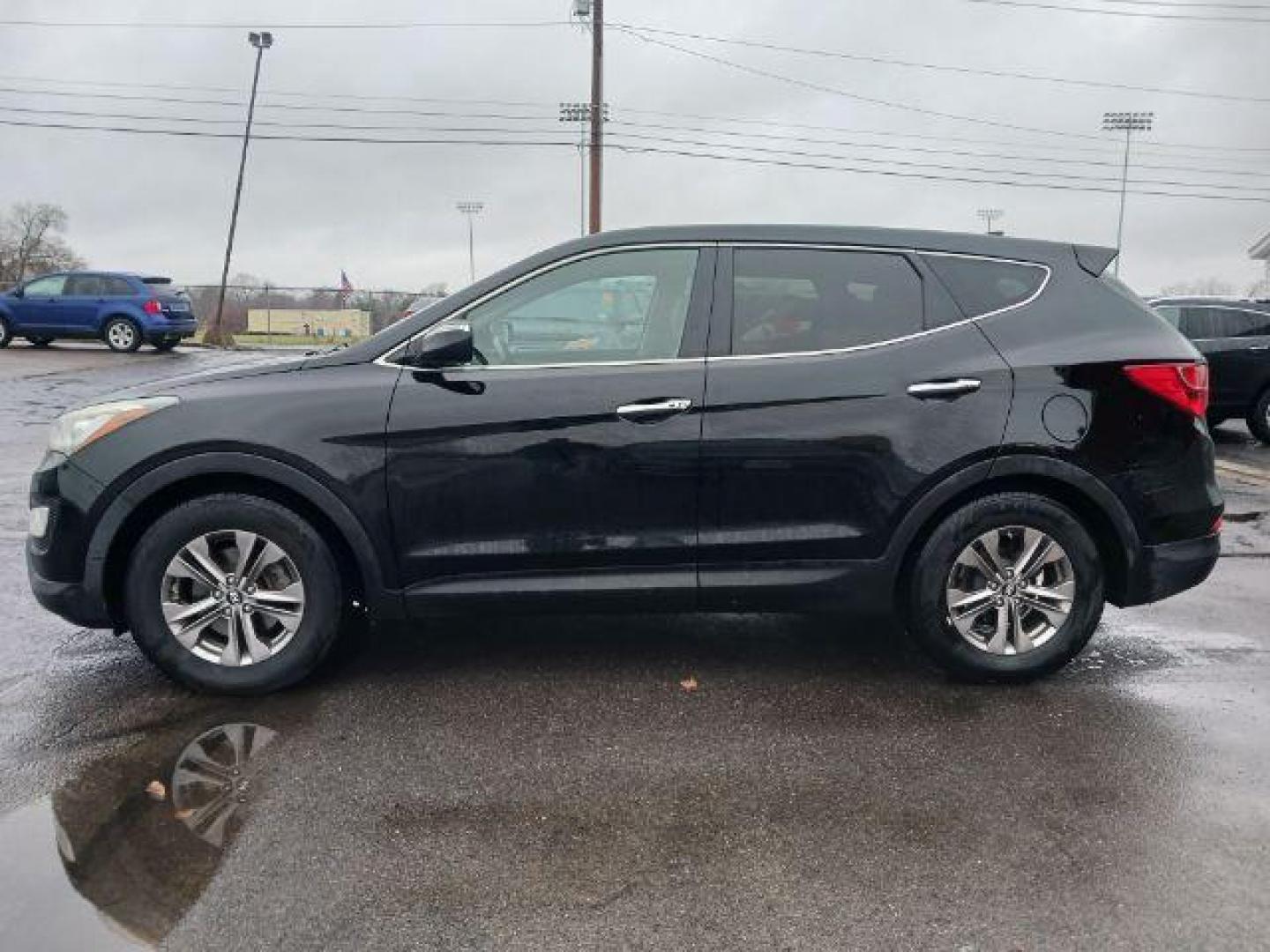 2013 Twilight Black Hyundai Santa Fe Sport 2.4 FWD (5XYZU3LB3DG) with an 2.4L L4 DOHC 16V engine, 6-Speed Automatic transmission, located at 401 Woodman Dr, Riverside, OH, 45431, (937) 908-9800, 39.763779, -84.122063 - Photo#3