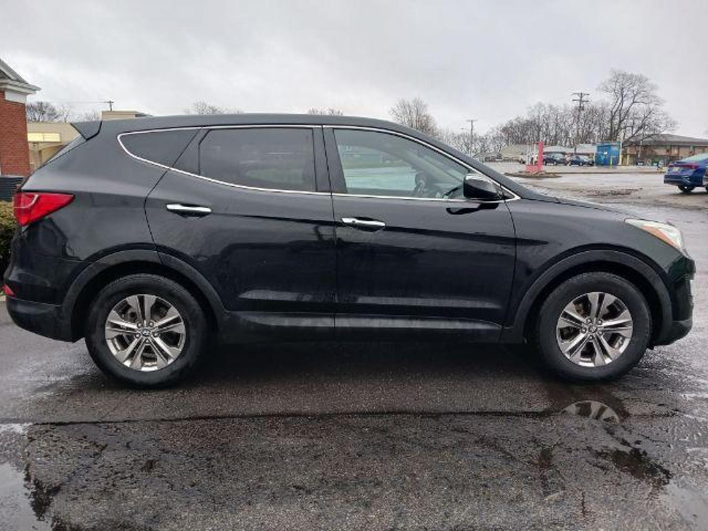 2013 Twilight Black Hyundai Santa Fe Sport 2.4 FWD (5XYZU3LB3DG) with an 2.4L L4 DOHC 16V engine, 6-Speed Automatic transmission, located at 401 Woodman Dr, Riverside, OH, 45431, (937) 908-9800, 39.763779, -84.122063 - Photo#4