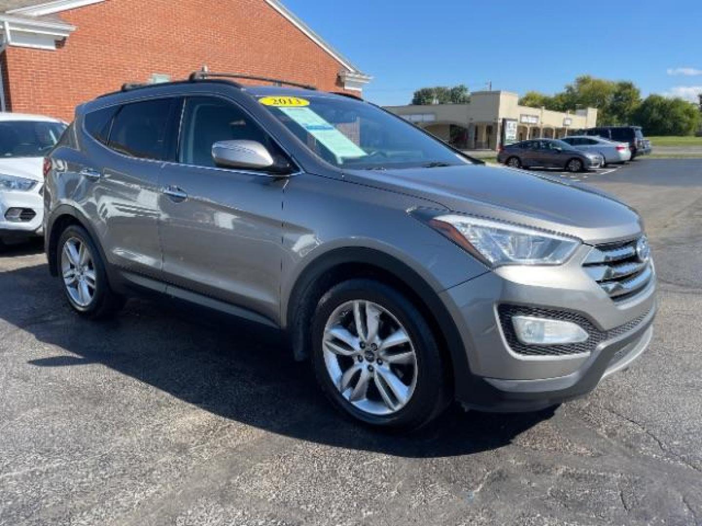 2013 Mineral Gray Hyundai Santa Fe Sport 2.0 FWD (5XYZU3LA8DG) with an 2.0L L4 DOHC 16V engine, 6-Speed Automatic transmission, located at 1951 S Dayton Lakeview Rd., New Carlisle, OH, 45344, (937) 908-9800, 39.890999, -84.050255 - Photo#0