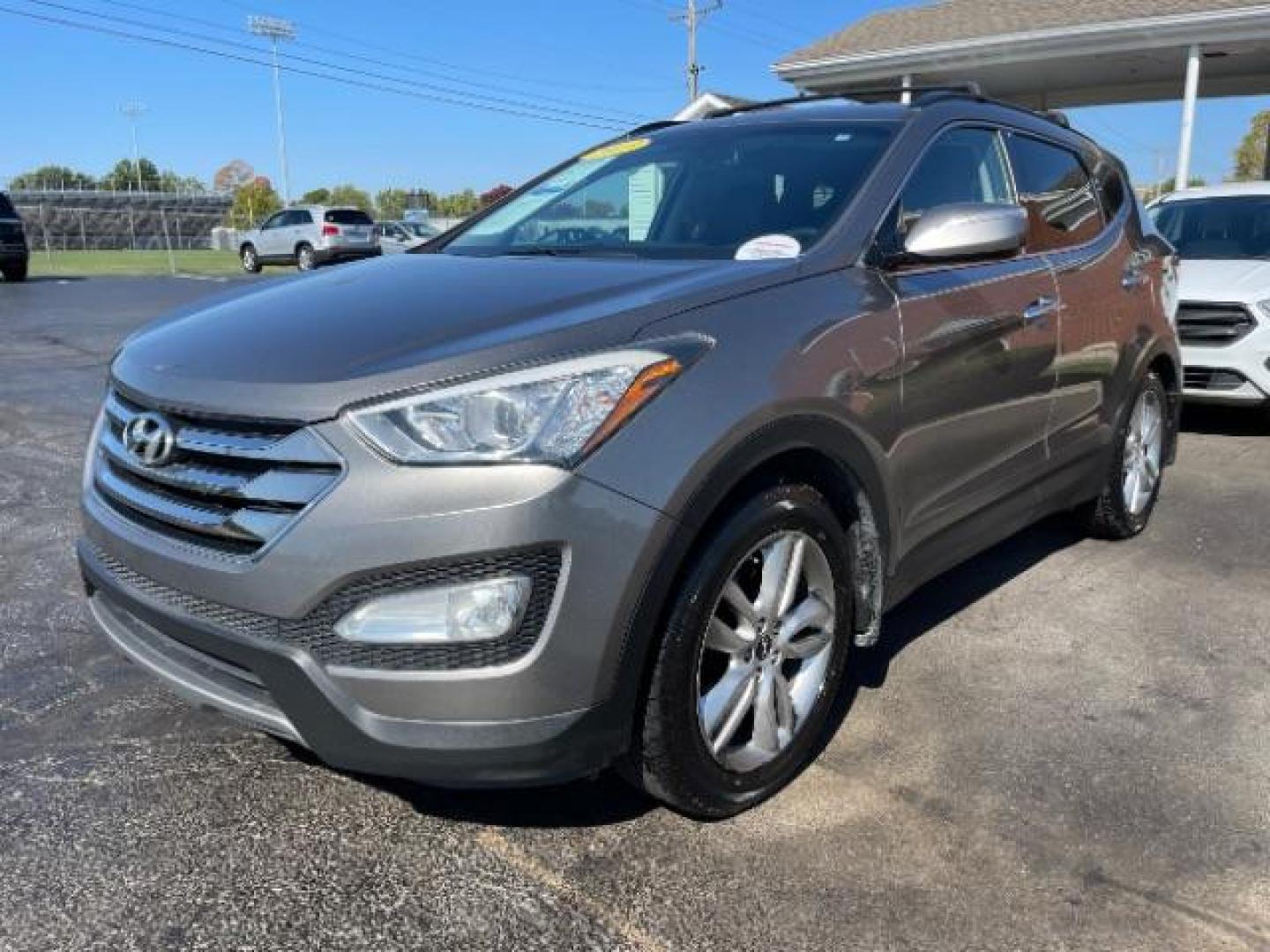 2013 Mineral Gray Hyundai Santa Fe Sport 2.0 FWD (5XYZU3LA8DG) with an 2.0L L4 DOHC 16V engine, 6-Speed Automatic transmission, located at 1951 S Dayton Lakeview Rd., New Carlisle, OH, 45344, (937) 908-9800, 39.890999, -84.050255 - Photo#1