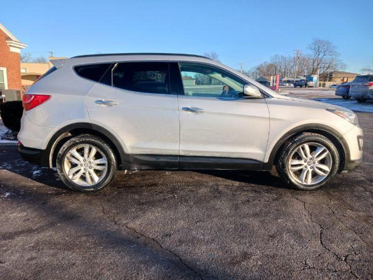 2013 Moonstone Silver Hyundai Santa Fe Sport 2.0 AWD (5XYZUDLA4DG) with an 2.0L L4 DOHC 16V engine, 6-Speed Automatic transmission, located at 1230 East Main St, Xenia, OH, 45385, (937) 908-9800, 39.687321, -83.910294 - Photo#4