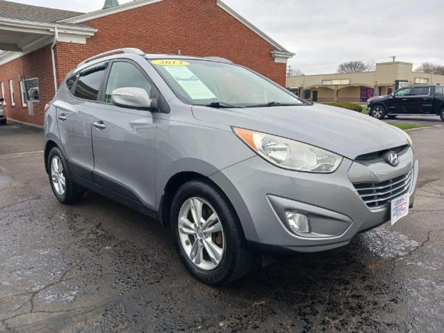 2013 Diamond Silver Metallic Hyundai Tucson GLS AWD (KM8JUCAC2DU) with an 2.4L L4 DOHC 16V engine, 6-Speed Automatic transmission, located at 401 Woodman Dr, Riverside, OH, 45431, (937) 908-9800, 39.763779, -84.122063 - Photo#0