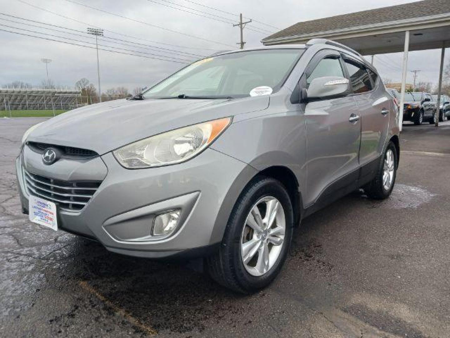 2013 Diamond Silver Metallic Hyundai Tucson GLS AWD (KM8JUCAC2DU) with an 2.4L L4 DOHC 16V engine, 6-Speed Automatic transmission, located at 401 Woodman Dr, Riverside, OH, 45431, (937) 908-9800, 39.763779, -84.122063 - Photo#2