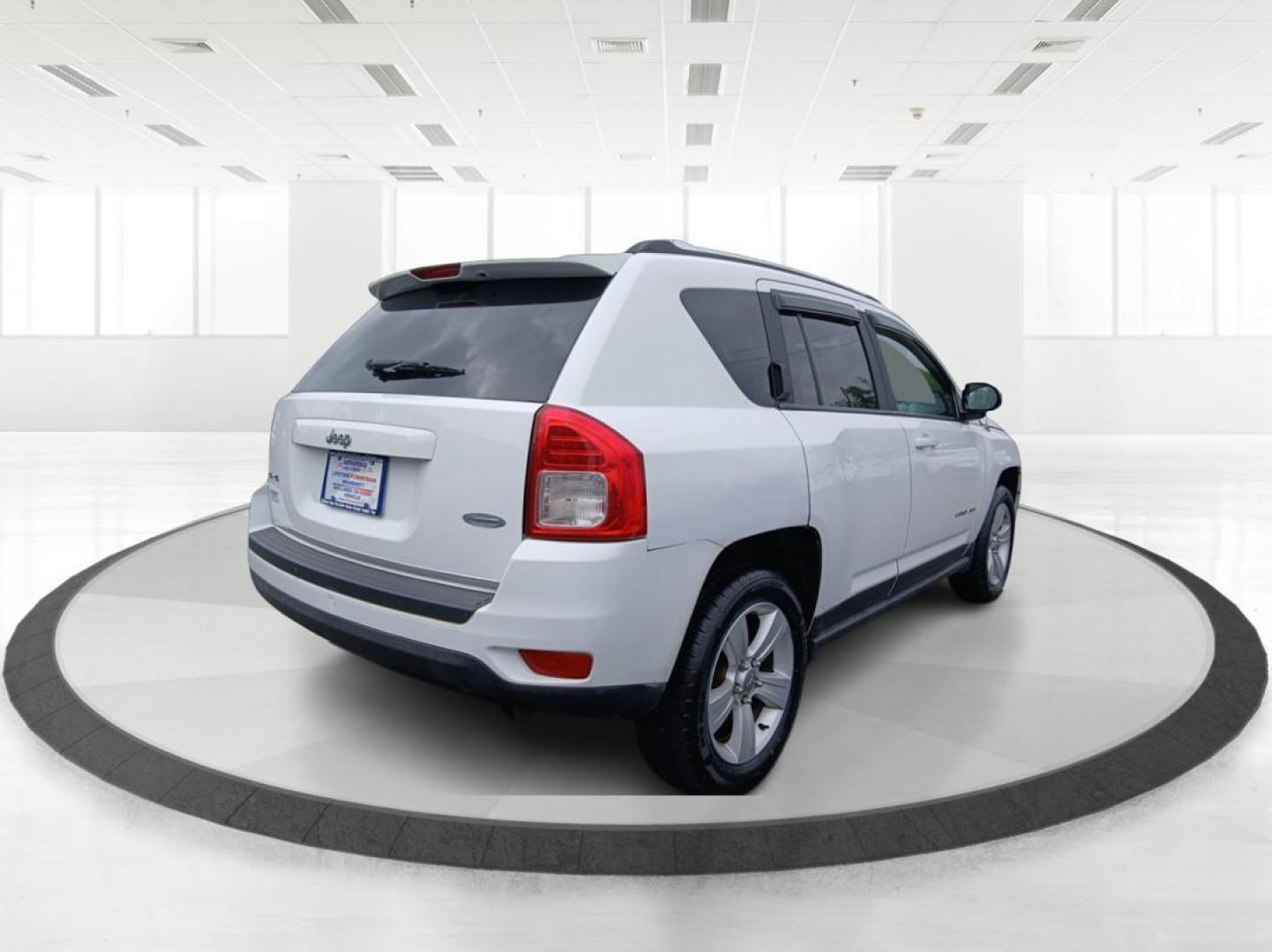 2013 Winter Chill Pearlcoat Jeep Compass Latitude 4WD (1C4NJDEB5DD) with an 2.4L L4 DOHC 16V engine, Continuously Variable Transmission transmission, located at 4508 South Dixie Dr, Moraine, OH, 45439, (937) 908-9800, 39.690136, -84.216438 - Photo#2