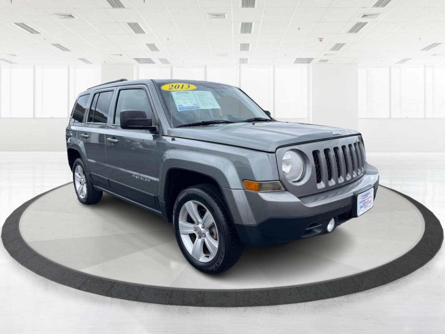 2013 Mineral Gray Metallic Jeep Patriot Latitude 4WD (1C4NJRFB5DD) with an 2.4L L4 DOHC 16V engine, located at 1099 N County Rd 25A, OH, 45373, (937) 908-9800, 40.057079, -84.212883 - Photo#0