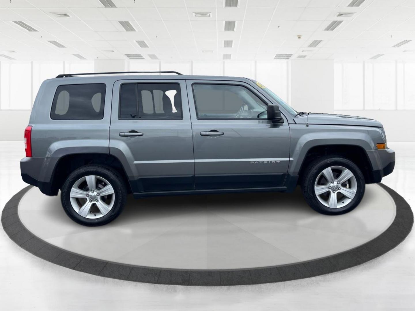 2013 Mineral Gray Metallic Jeep Patriot Latitude 4WD (1C4NJRFB5DD) with an 2.4L L4 DOHC 16V engine, located at 1099 N County Rd 25A, OH, 45373, (937) 908-9800, 40.057079, -84.212883 - Photo#1