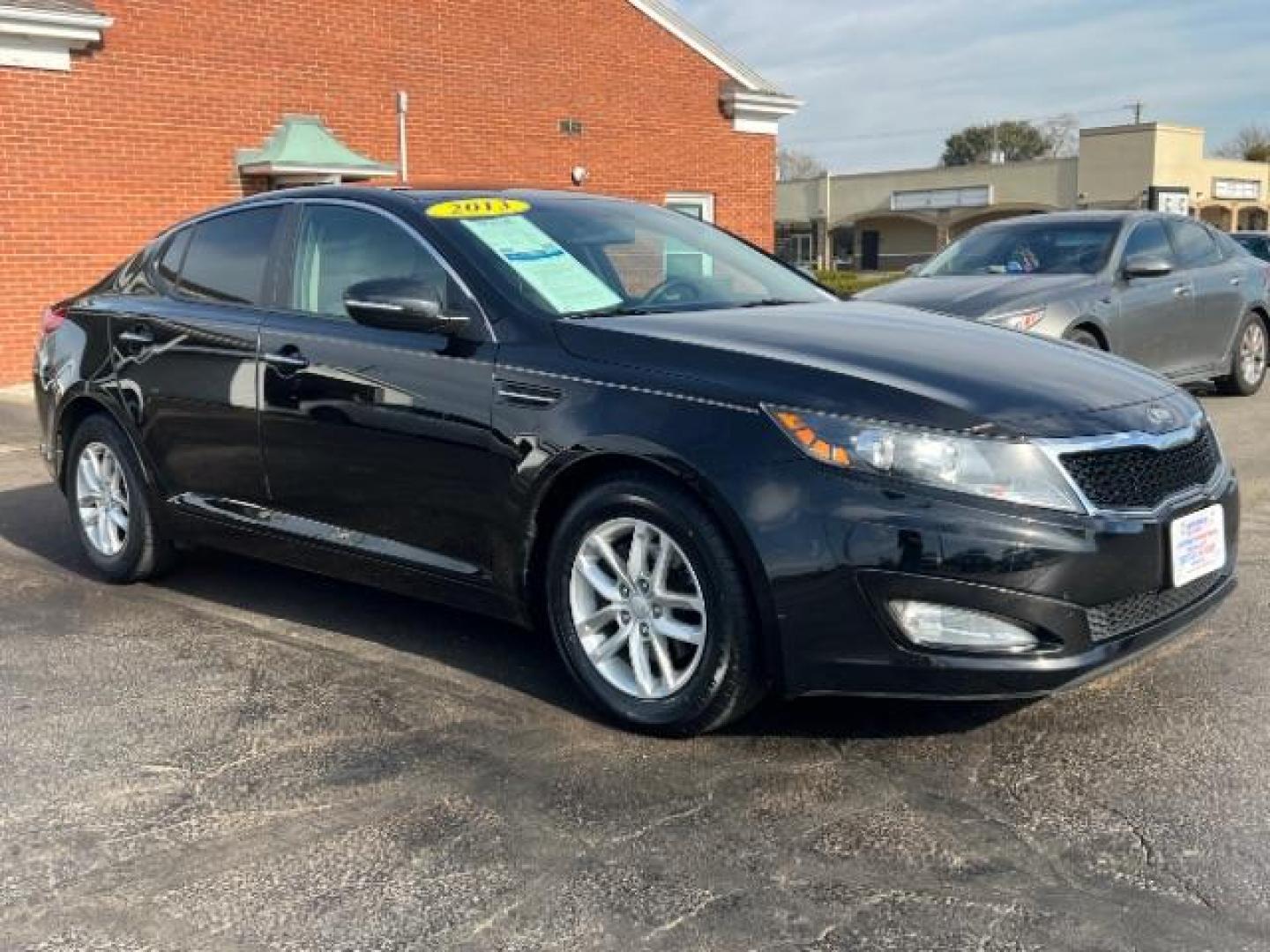 2013 Ebony Black Kia Optima LX AT (5XXGM4A7XDG) with an 2.4L L4 DOHC 16V engine, 6-Speed Automatic transmission, located at 1099 N County Rd 25A, OH, 45373, (937) 908-9800, 40.057079, -84.212883 - Photo#0