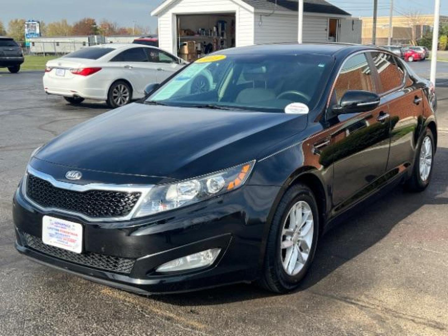 2013 Ebony Black Kia Optima LX AT (5XXGM4A7XDG) with an 2.4L L4 DOHC 16V engine, 6-Speed Automatic transmission, located at 1099 N County Rd 25A, OH, 45373, (937) 908-9800, 40.057079, -84.212883 - Photo#2