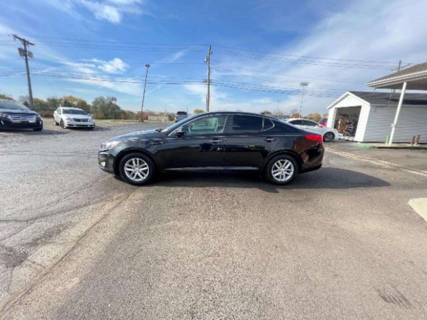 2013 Ebony Black Kia Optima LX AT (5XXGM4A7XDG) with an 2.4L L4 DOHC 16V engine, 6-Speed Automatic transmission, located at 1099 N County Rd 25A, OH, 45373, (937) 908-9800, 40.057079, -84.212883 - Photo#3