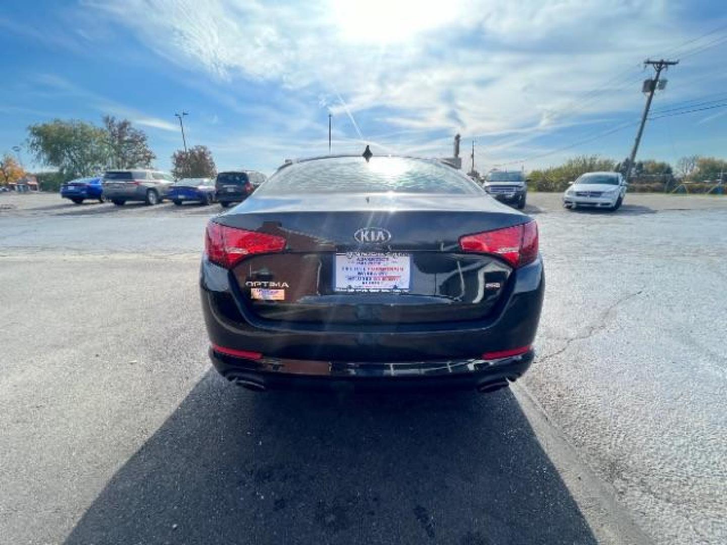 2013 Ebony Black Kia Optima LX AT (5XXGM4A7XDG) with an 2.4L L4 DOHC 16V engine, 6-Speed Automatic transmission, located at 1099 N County Rd 25A, OH, 45373, (937) 908-9800, 40.057079, -84.212883 - Photo#4