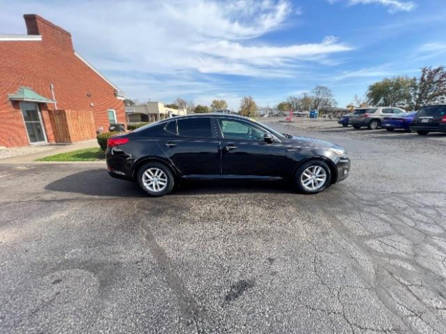 2013 Ebony Black Kia Optima LX AT (5XXGM4A7XDG) with an 2.4L L4 DOHC 16V engine, 6-Speed Automatic transmission, located at 1099 N County Rd 25A, OH, 45373, (937) 908-9800, 40.057079, -84.212883 - Photo#5