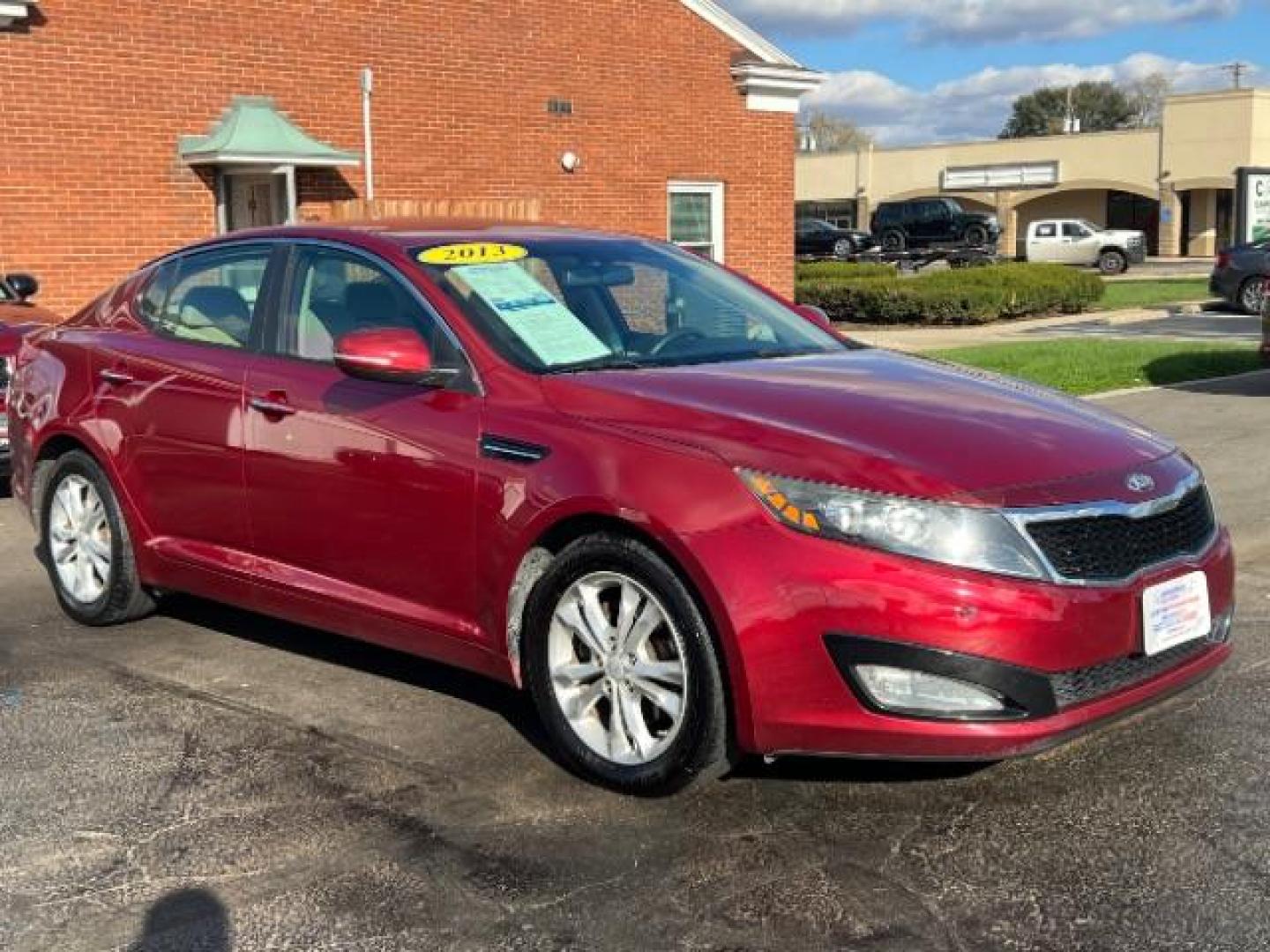 2013 Remington Red Metallic Kia Optima LX AT (5XXGM4A71DG) with an 2.4L L4 DOHC 16V engine, 6-Speed Automatic transmission, located at 1230 East Main St, Xenia, OH, 45385, (937) 908-9800, 39.687321, -83.910294 - Photo#0