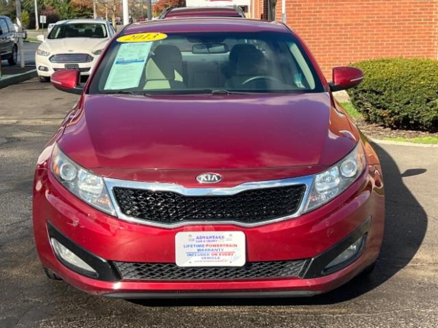 2013 Remington Red Metallic Kia Optima LX AT (5XXGM4A71DG) with an 2.4L L4 DOHC 16V engine, 6-Speed Automatic transmission, located at 1230 East Main St, Xenia, OH, 45385, (937) 908-9800, 39.687321, -83.910294 - Photo#1