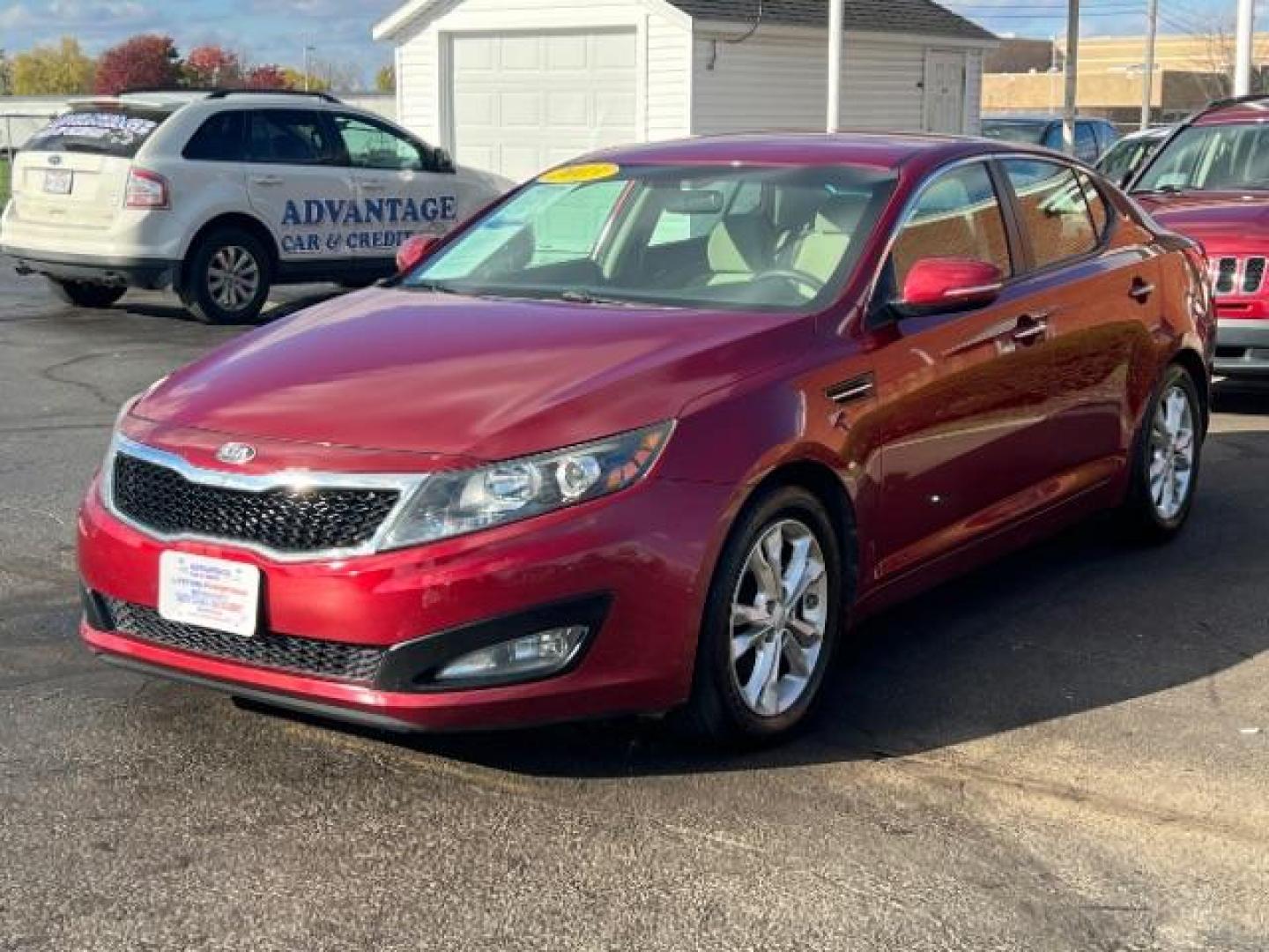 2013 Remington Red Metallic Kia Optima LX AT (5XXGM4A71DG) with an 2.4L L4 DOHC 16V engine, 6-Speed Automatic transmission, located at 1230 East Main St, Xenia, OH, 45385, (937) 908-9800, 39.687321, -83.910294 - Photo#2