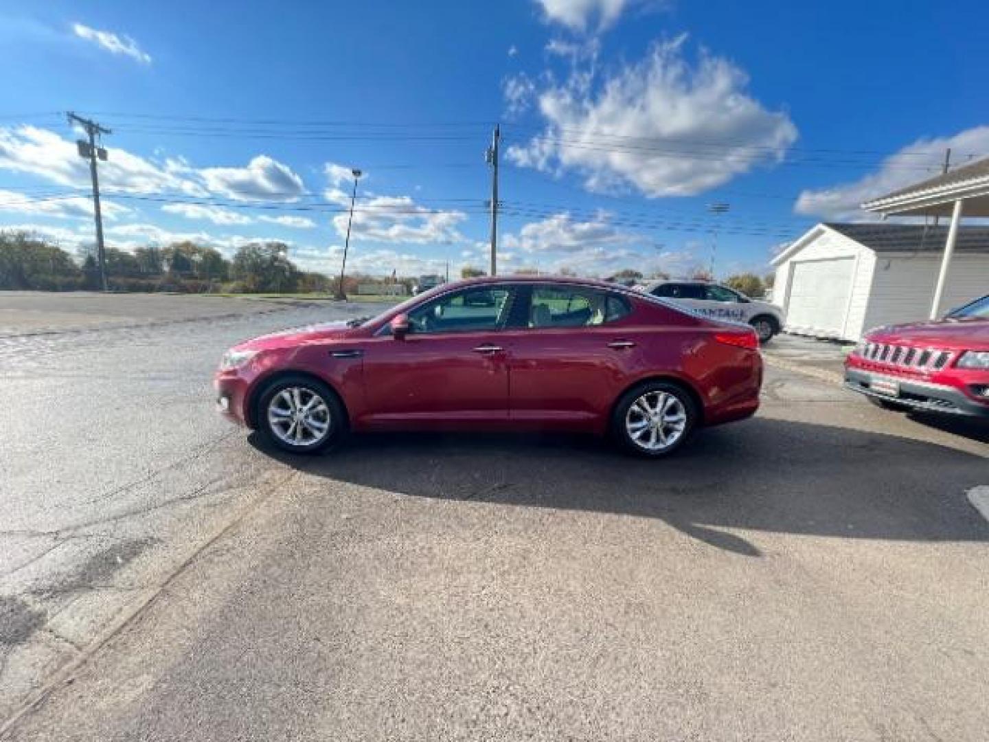 2013 Remington Red Metallic Kia Optima LX AT (5XXGM4A71DG) with an 2.4L L4 DOHC 16V engine, 6-Speed Automatic transmission, located at 1230 East Main St, Xenia, OH, 45385, (937) 908-9800, 39.687321, -83.910294 - Photo#3