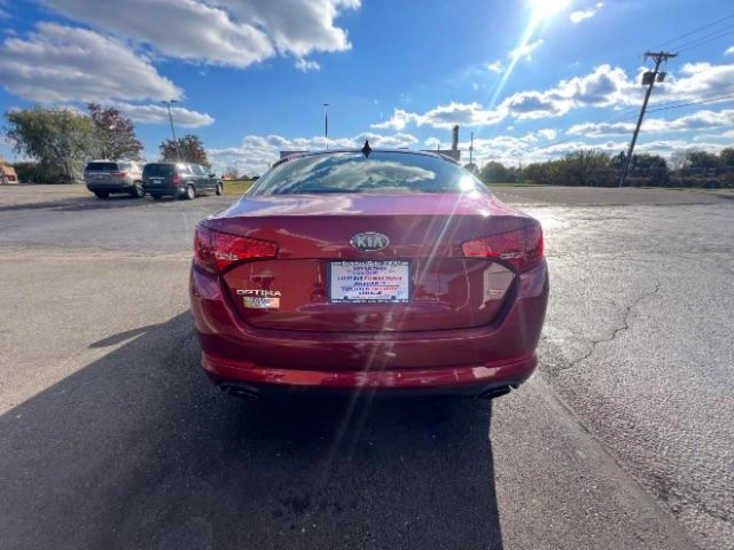 2013 Remington Red Metallic Kia Optima LX AT (5XXGM4A71DG) with an 2.4L L4 DOHC 16V engine, 6-Speed Automatic transmission, located at 1230 East Main St, Xenia, OH, 45385, (937) 908-9800, 39.687321, -83.910294 - Photo#4